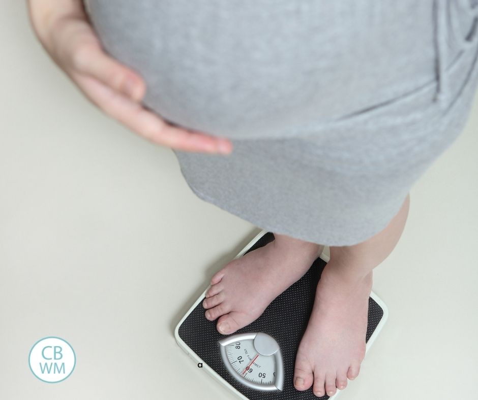 Pregnant woman on the scale