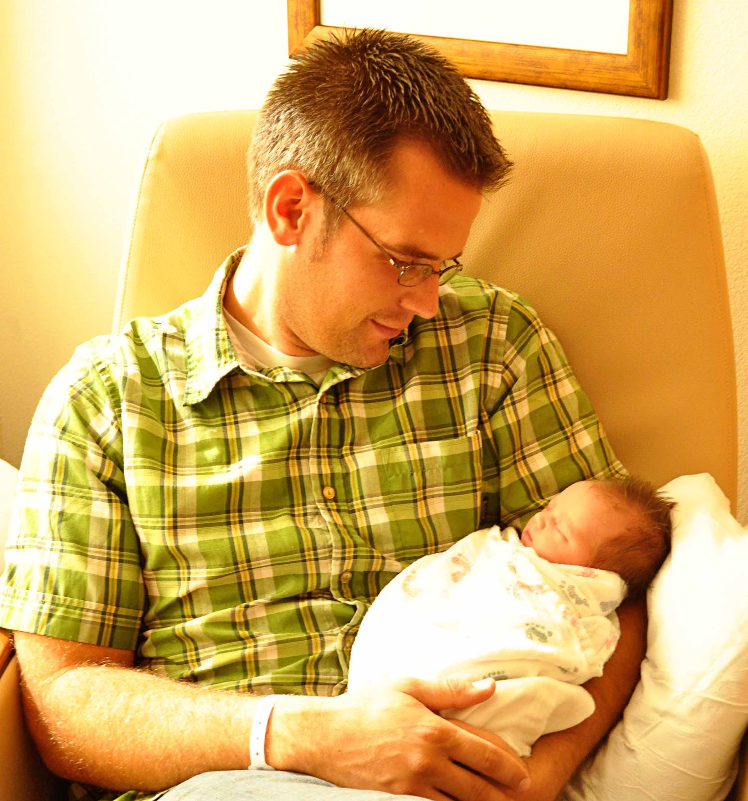 Nate holding Brinley in the hospital