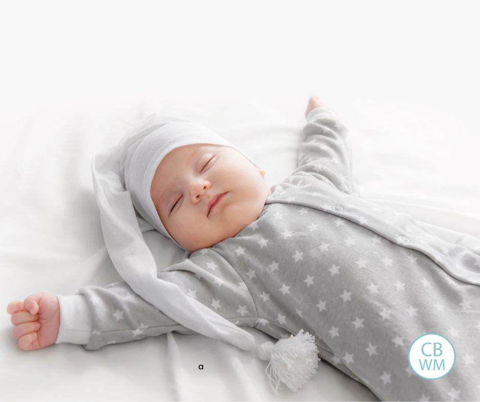 Baby sleeping in gray pajamas