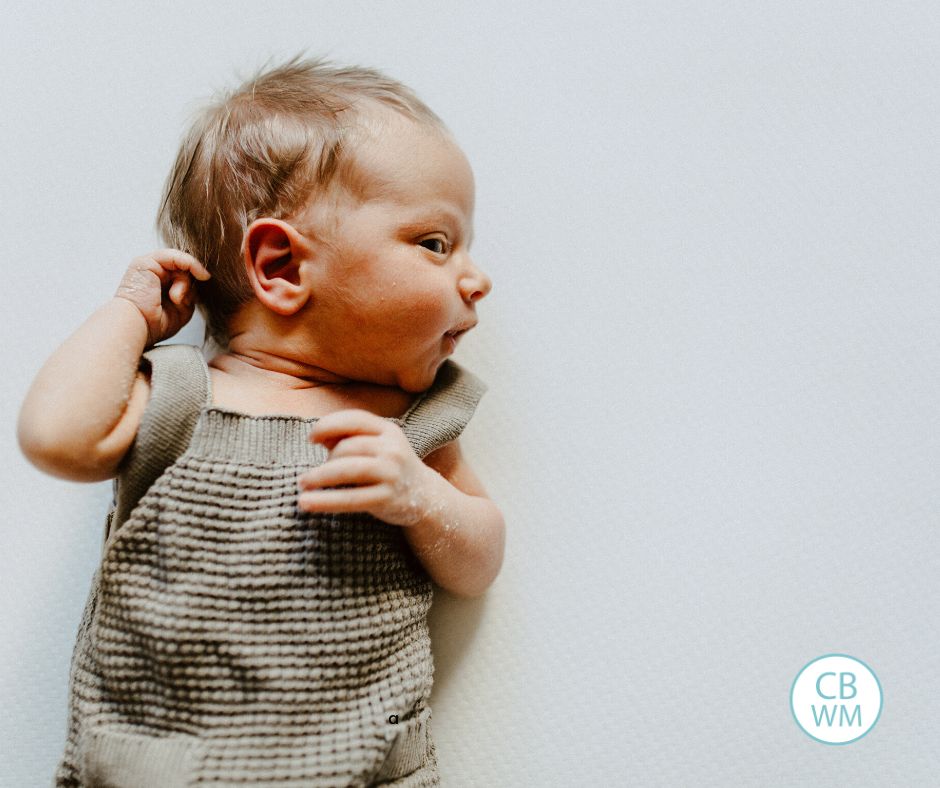 newborn baby looking to the side