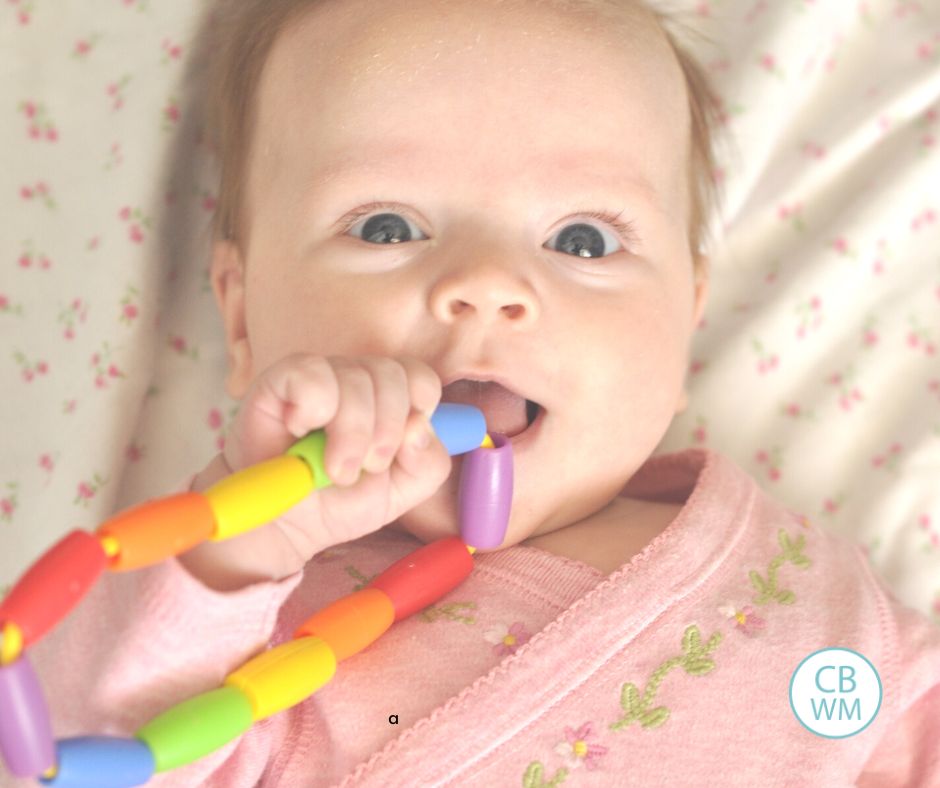 3 month old Brinley holding a toy