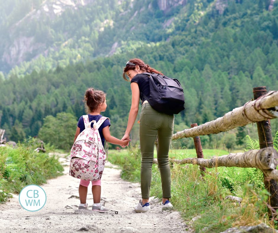 Mom and daughter walking hand in hand