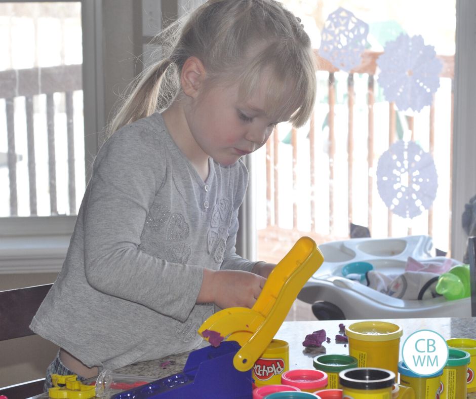 McKenna playing with playdoh