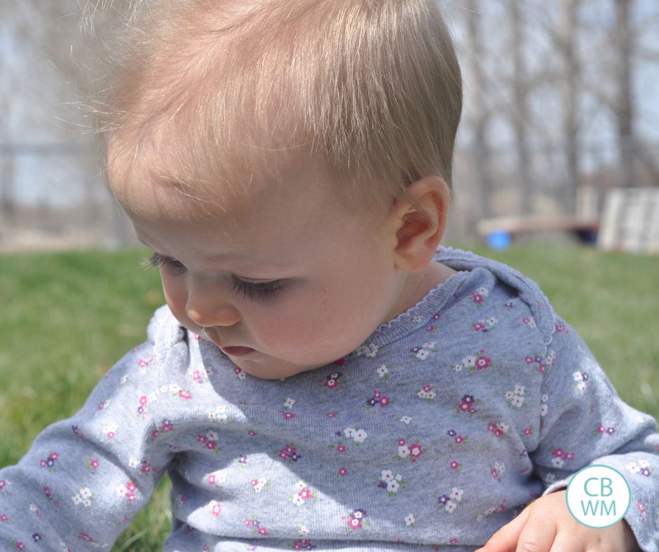 Brinley sitting outside