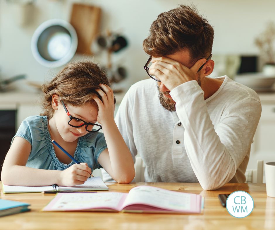 Parent and child doing homework together