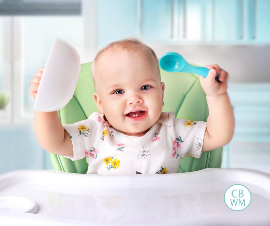 Baby sitting in high chair