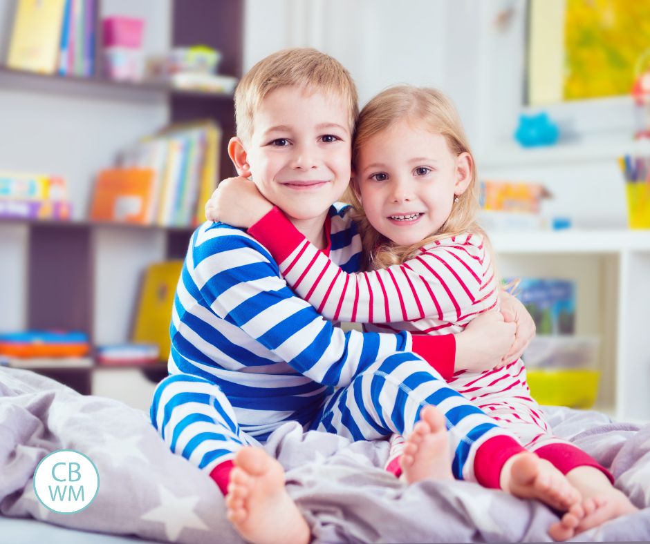 siblings hugging in their pajamas