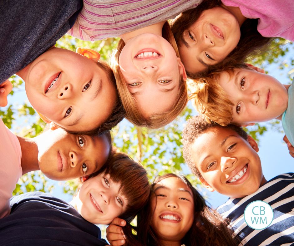 Kids in a circle looking down at the camera