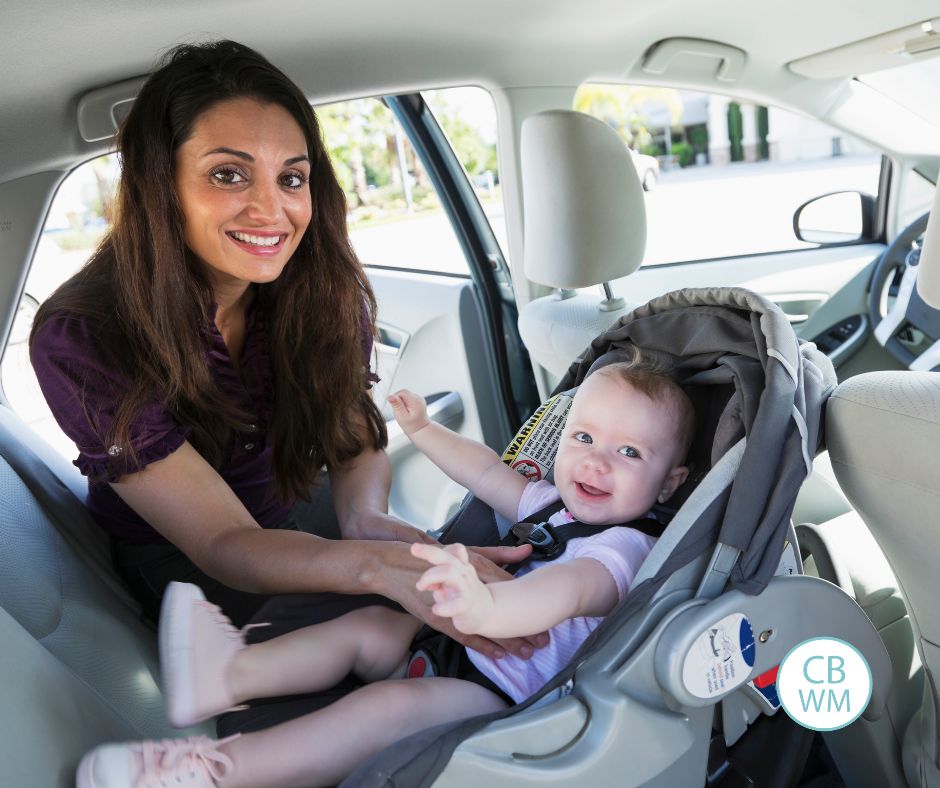 Mom with child in the car seat