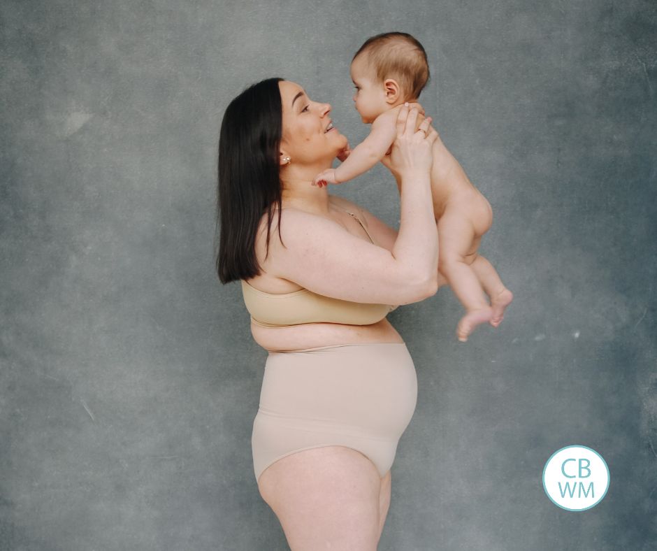 Postpartum mom holding baby