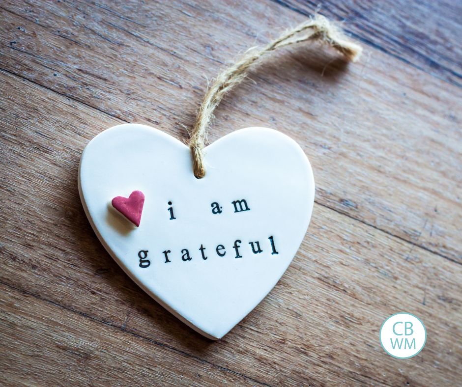 I am grateful engraved on a white heart ornament