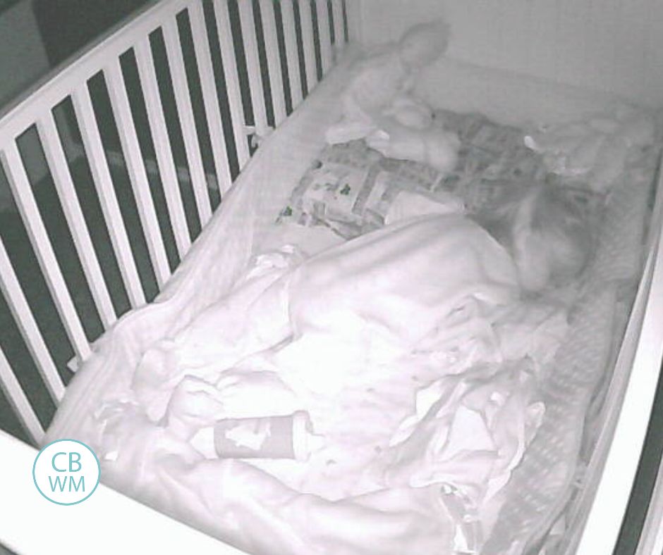17.5 month old sleeping in her crib for nap time.