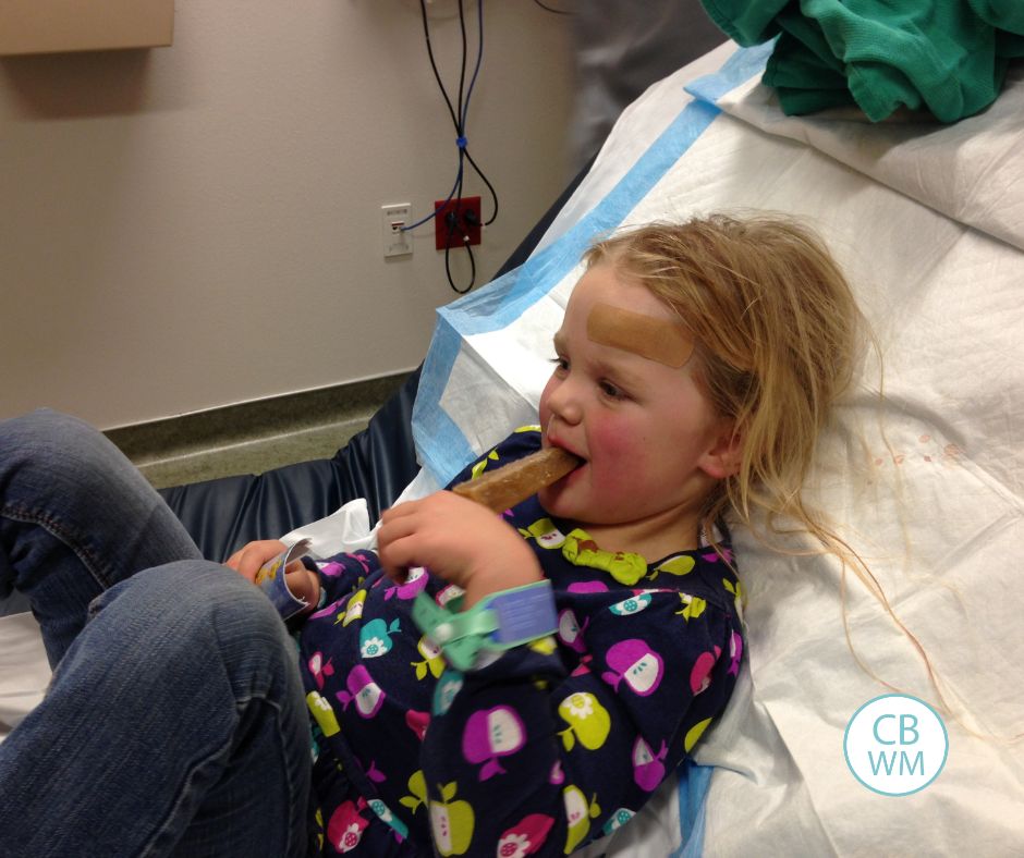 McKenna eating  a popsicle after getting stitches