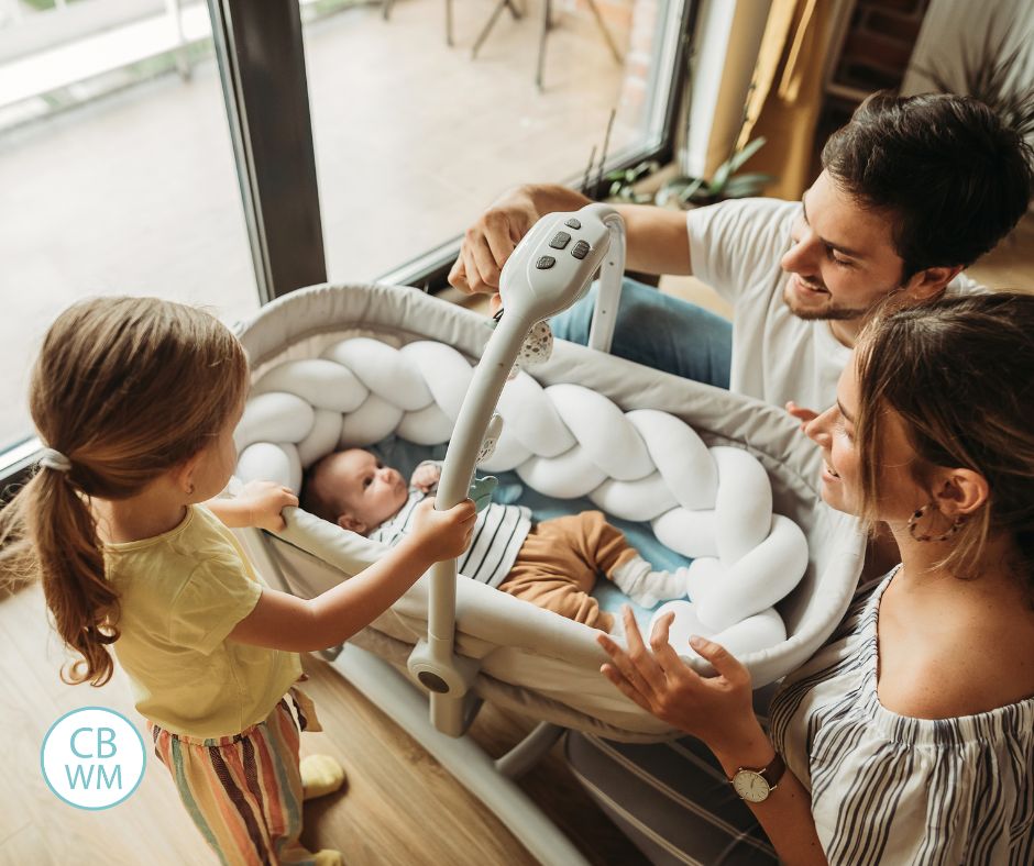 Parents and preschooler at home with a new baby