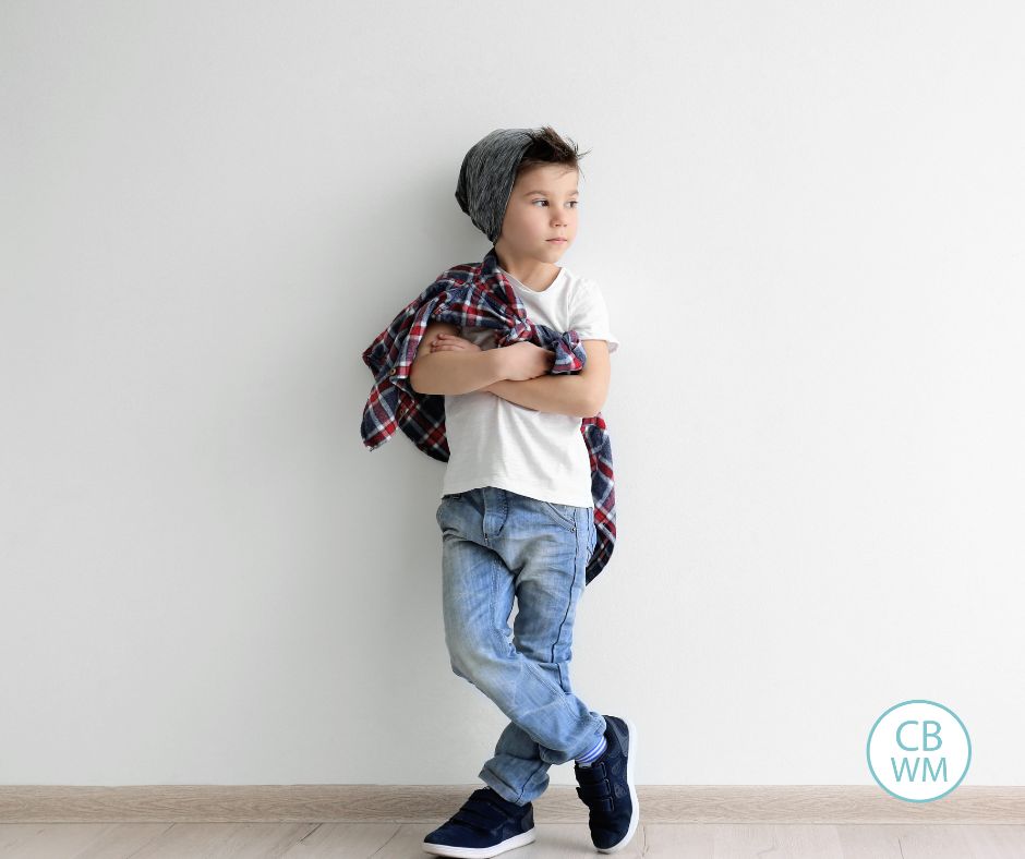 Boy leaning against a wall