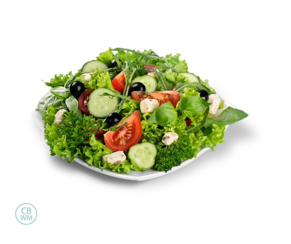 Green salad on a square, white plate