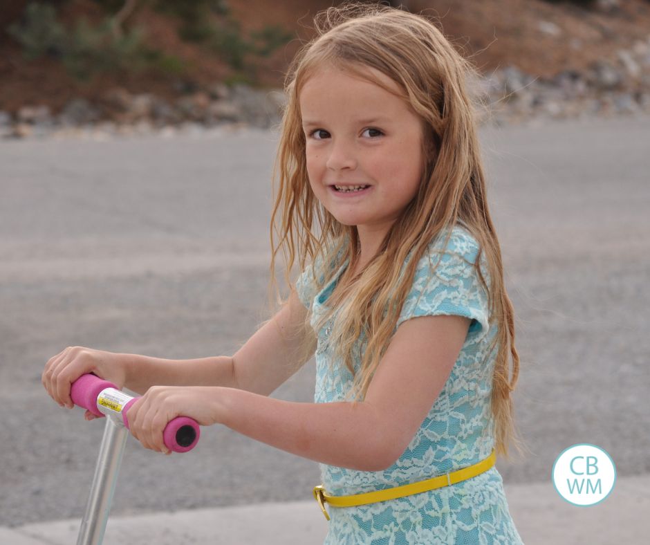 7 year old Kaitlyn riding a scooter