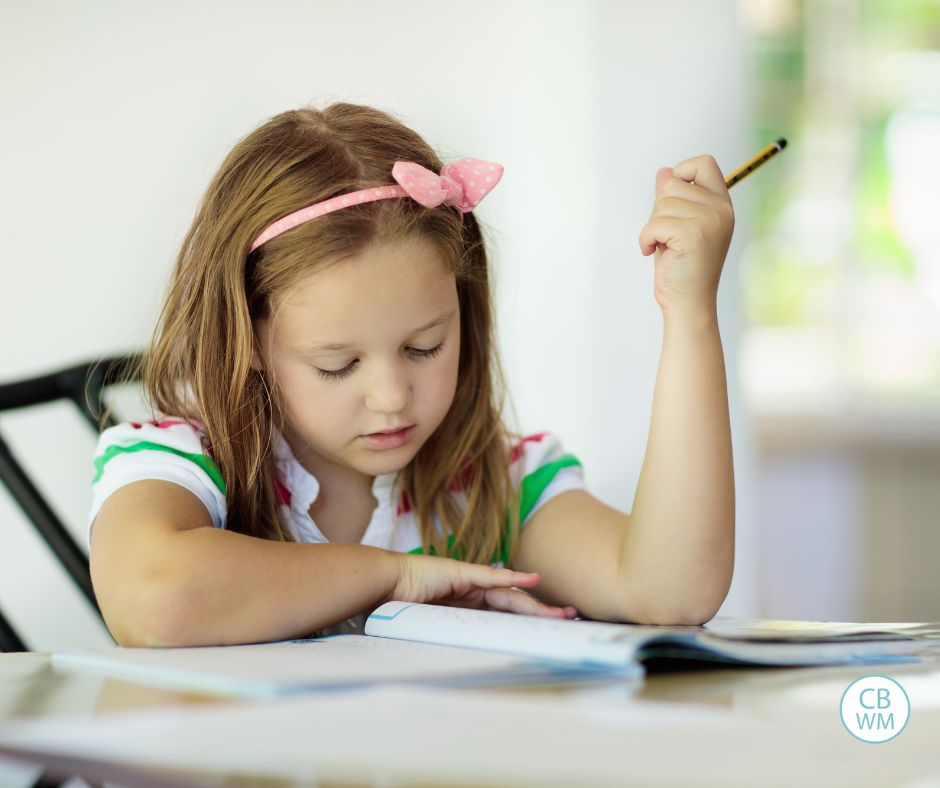 Child doing homework sitting at the table