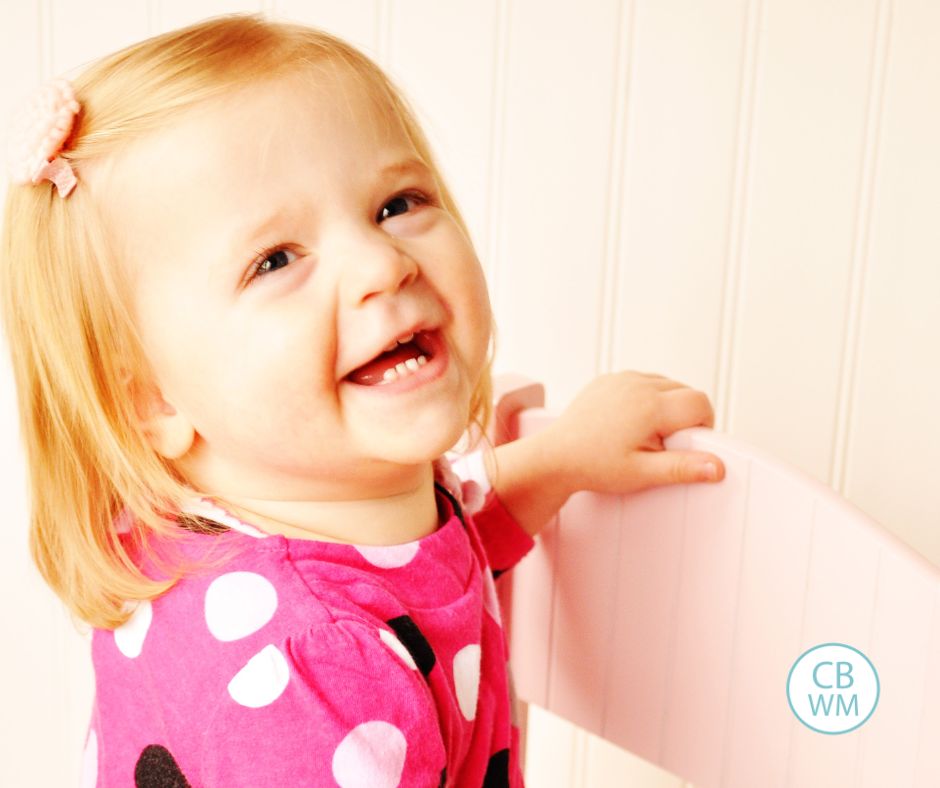 Brinley at 18 months old smiling and laughing