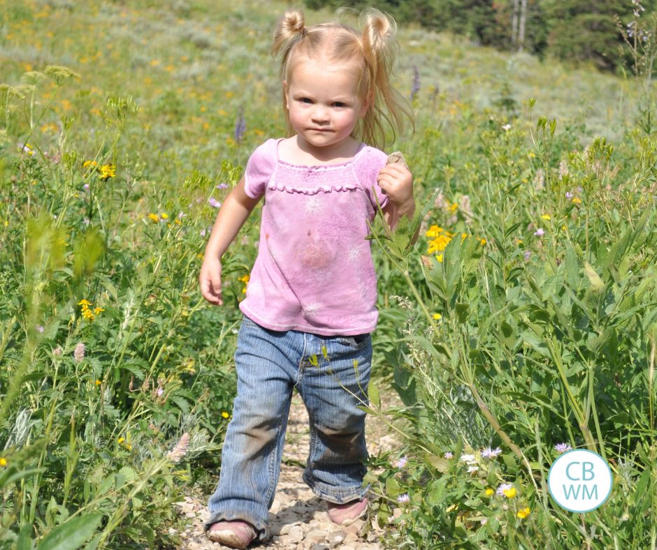 Brinley walking along a path in the mountains