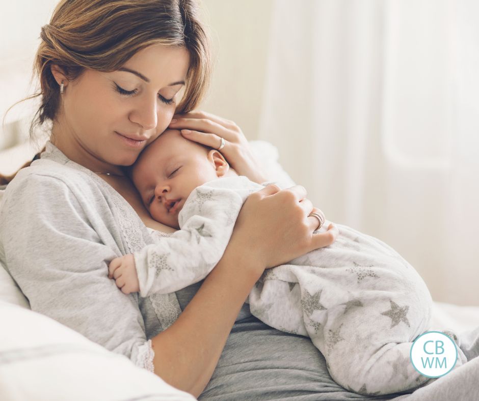 Mom holding her baby on her chest