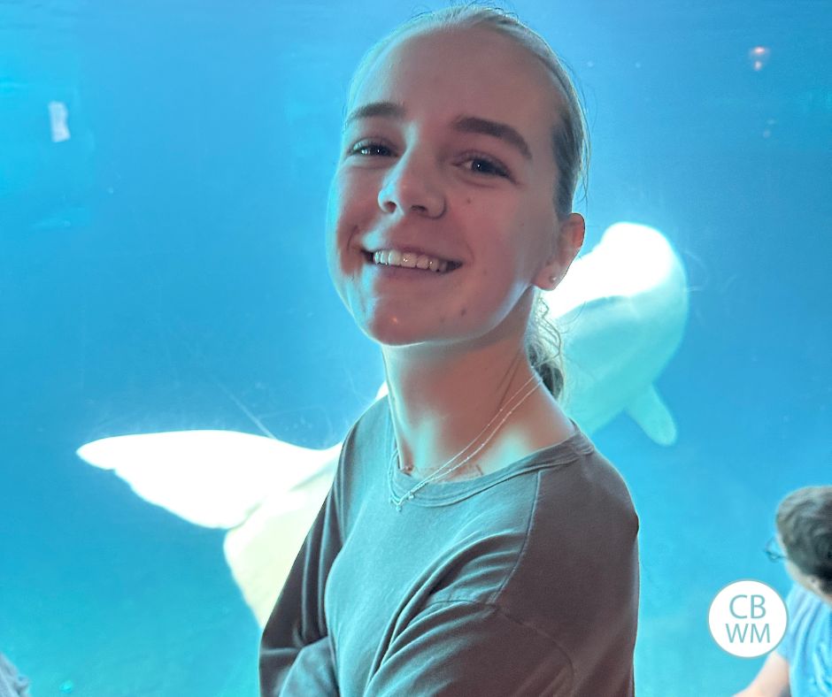 McKenna in front of the Beluga whale exhibit