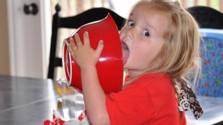 Girl licking out a bowl