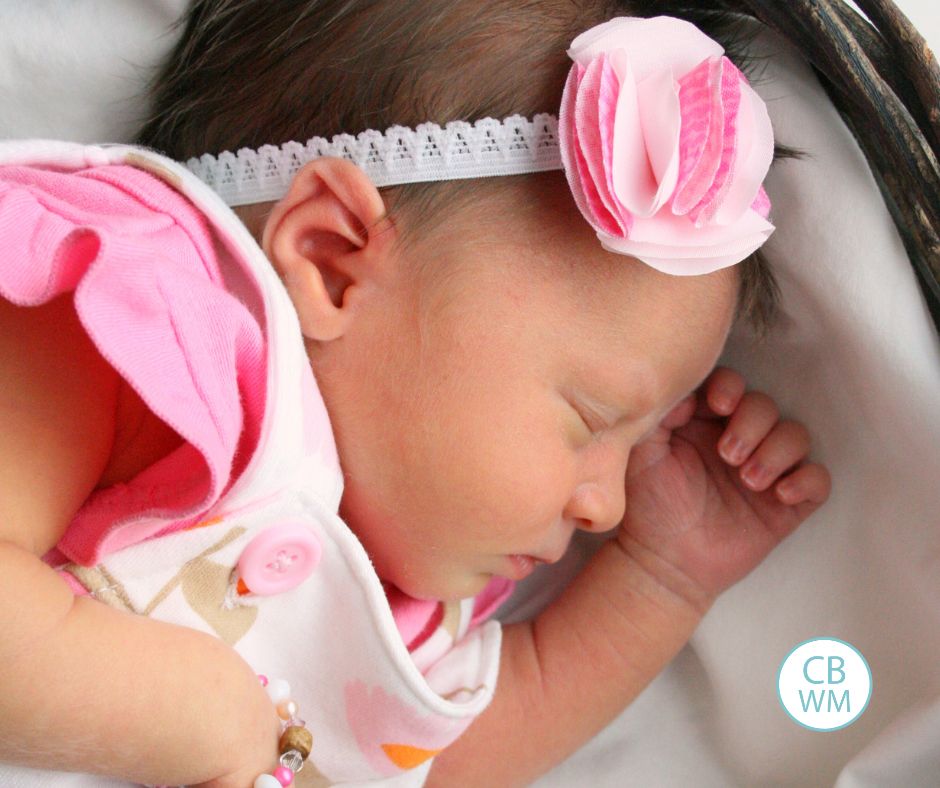 Newborn baby sleeping in a basket