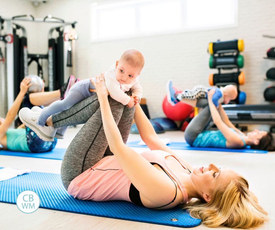 Mom doing exercise with her baby
