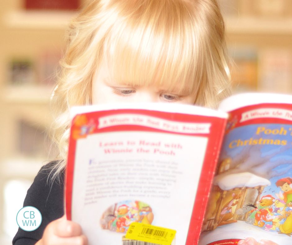 McKenna closely reading a book