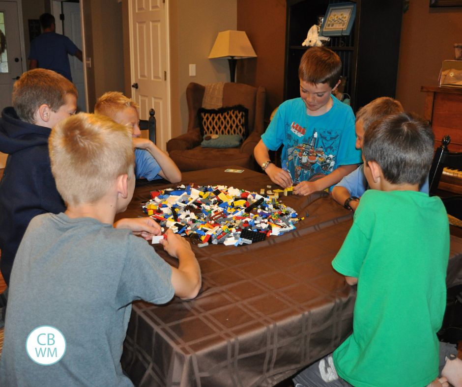 A group of boys playing with LEGOs