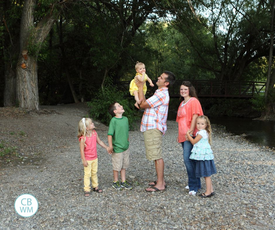 Our family standing on the beach of a river