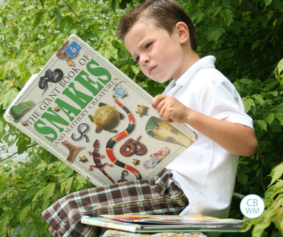 Brayden reading a book outside