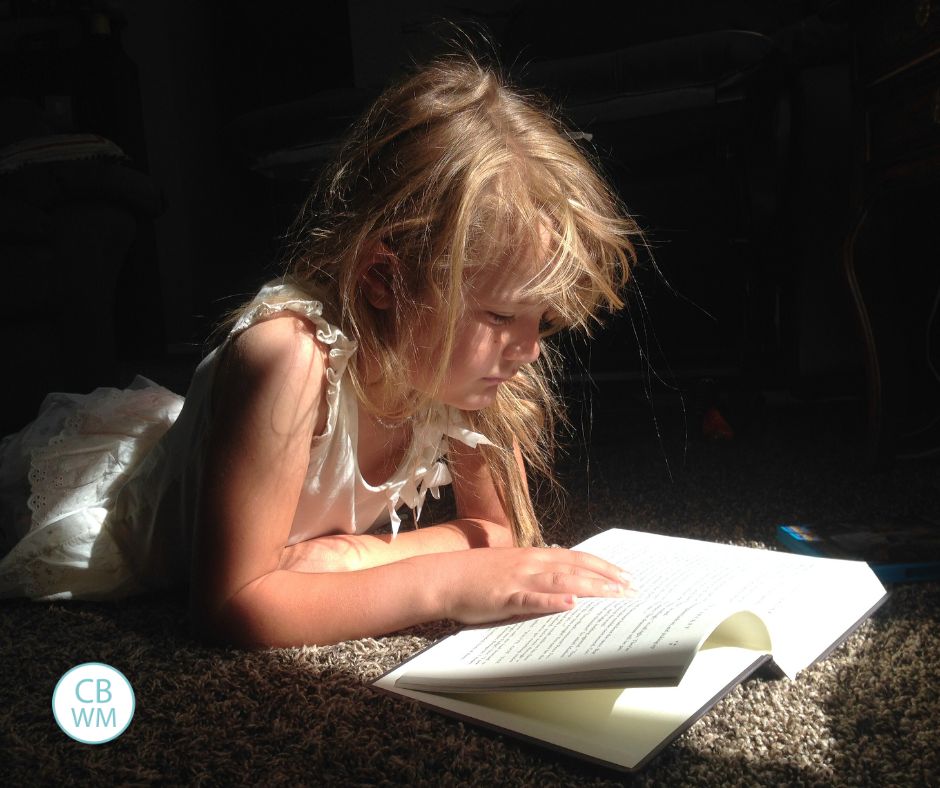 Kaitlyn reading a book in the morning light