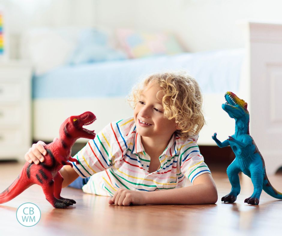 Child playing with dinosaurs