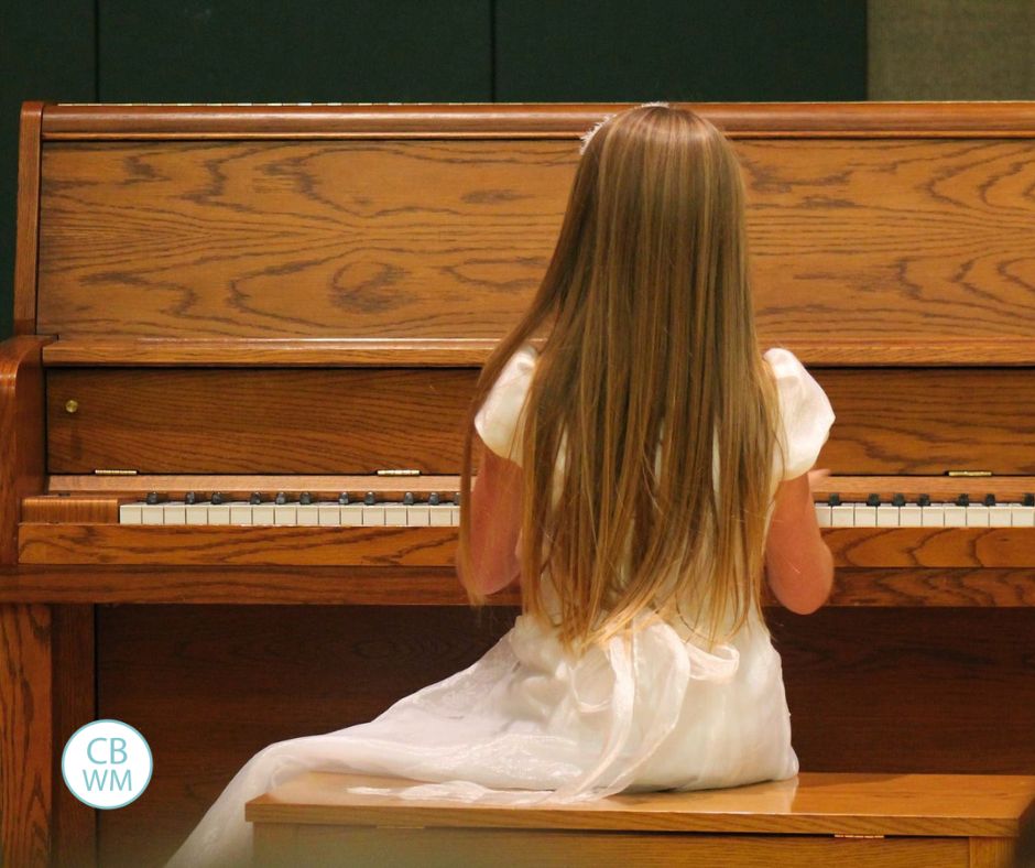 Kaitlyn playing at her piano recital