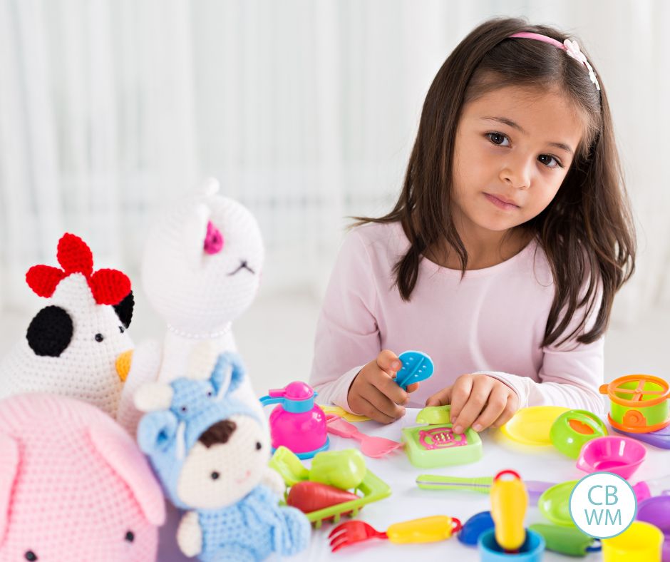 Girl playing with toys in her room