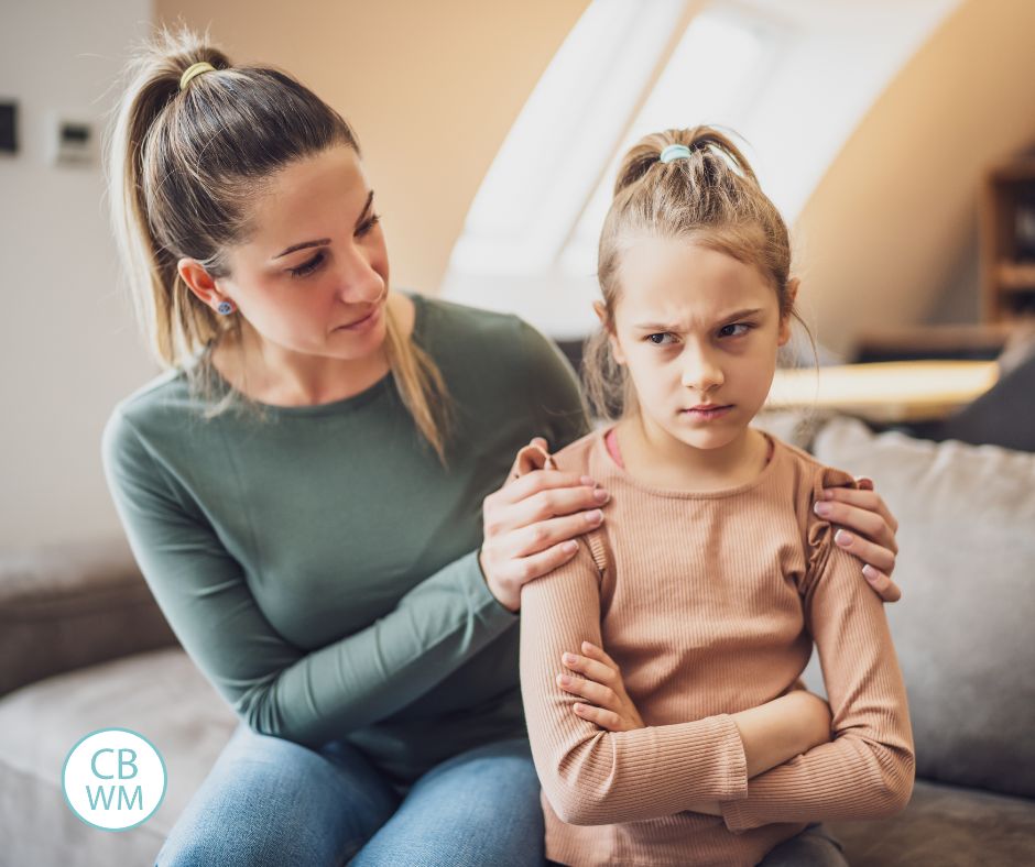 Mom comforting child on couch