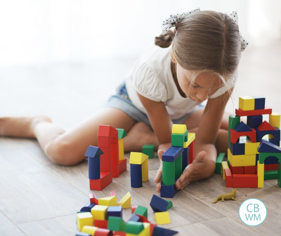 School-aged child playing with toys