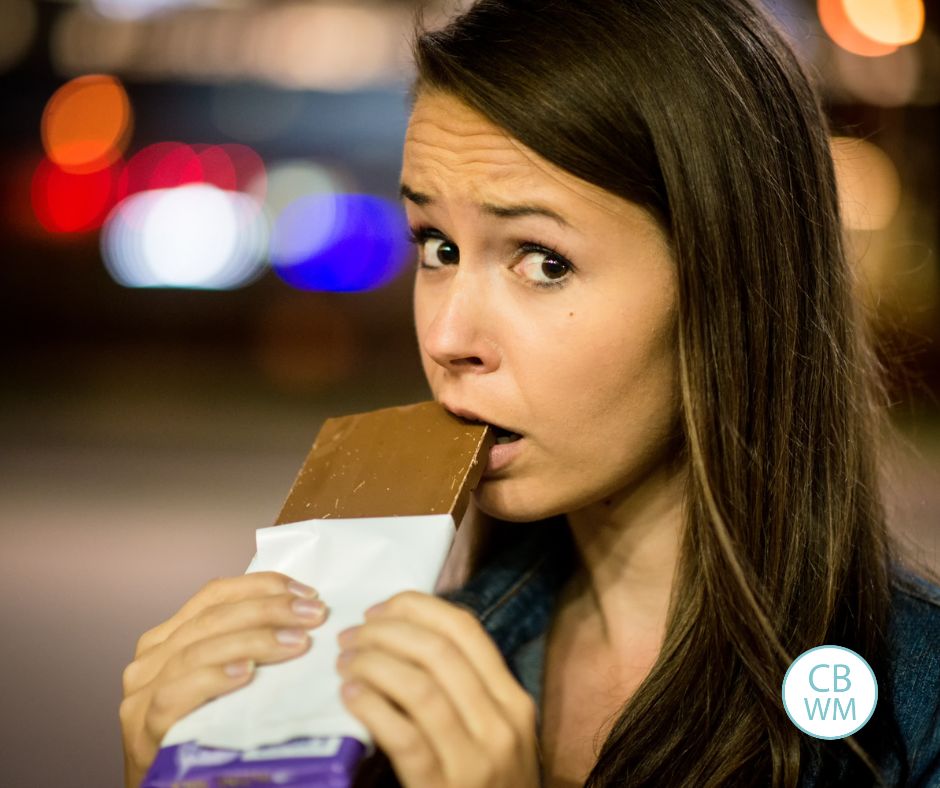 Woman eating a chocolate bar