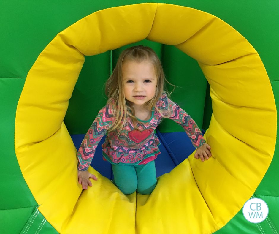 Brinley playing in a blow up toy