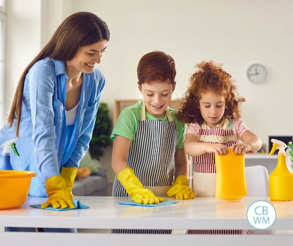 Mom doing chores with kids