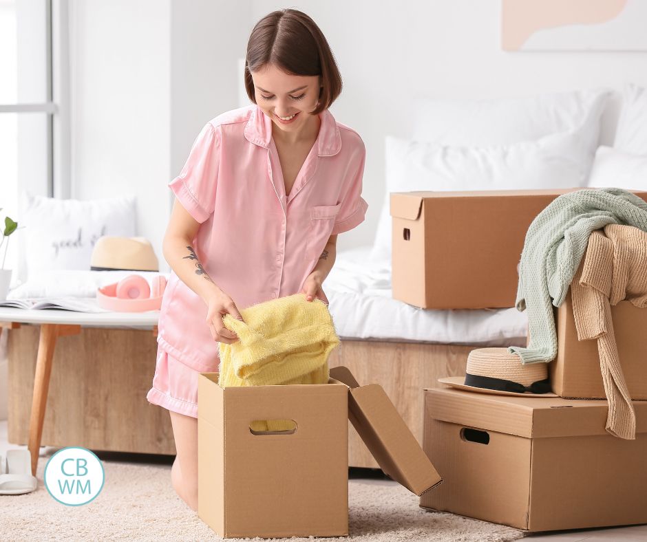Woman organizing bedroom