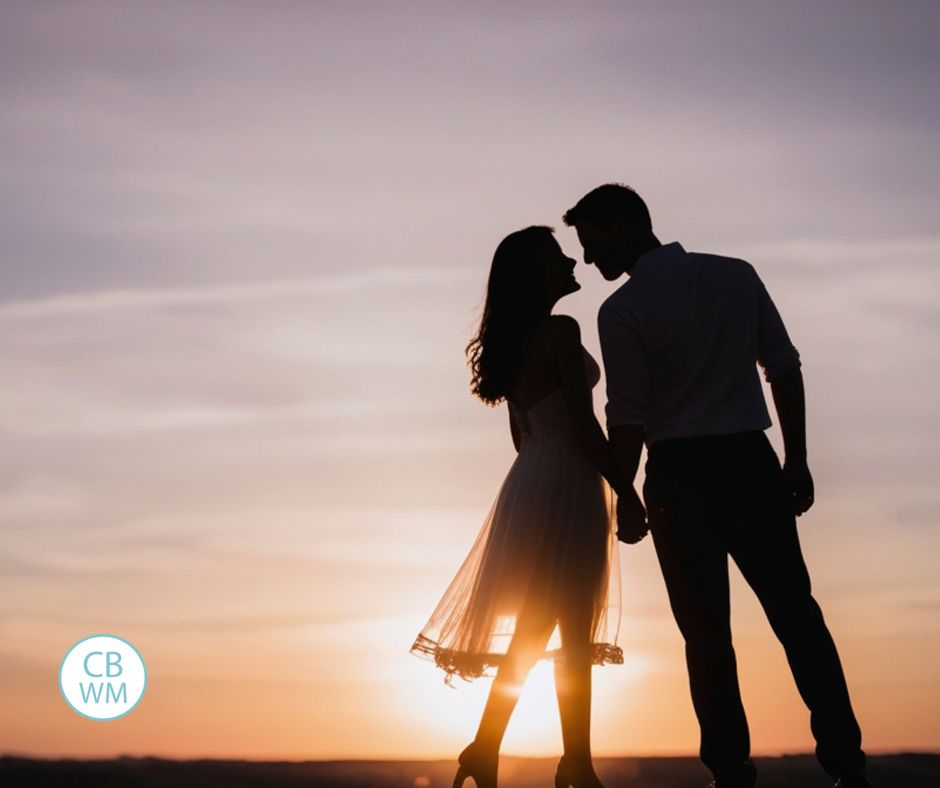 Married couple with a sunset in the background