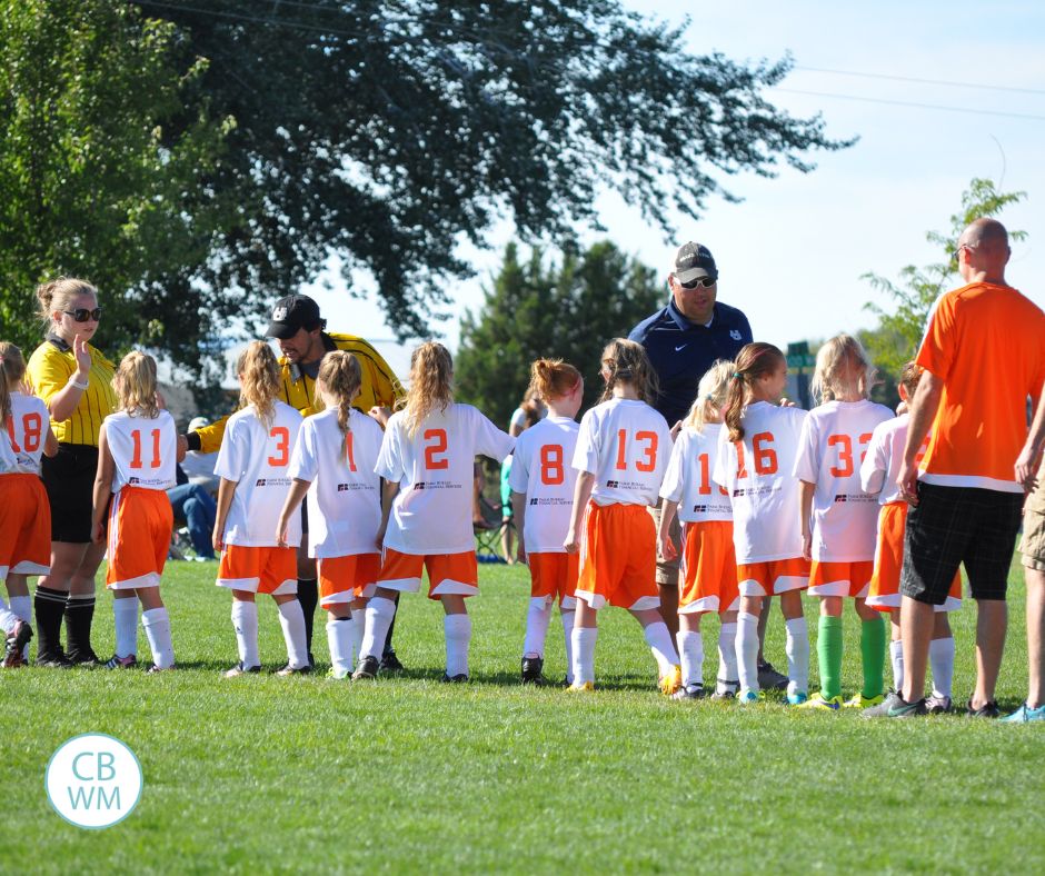 Kaitlyn's team shaking hands with the opposing team