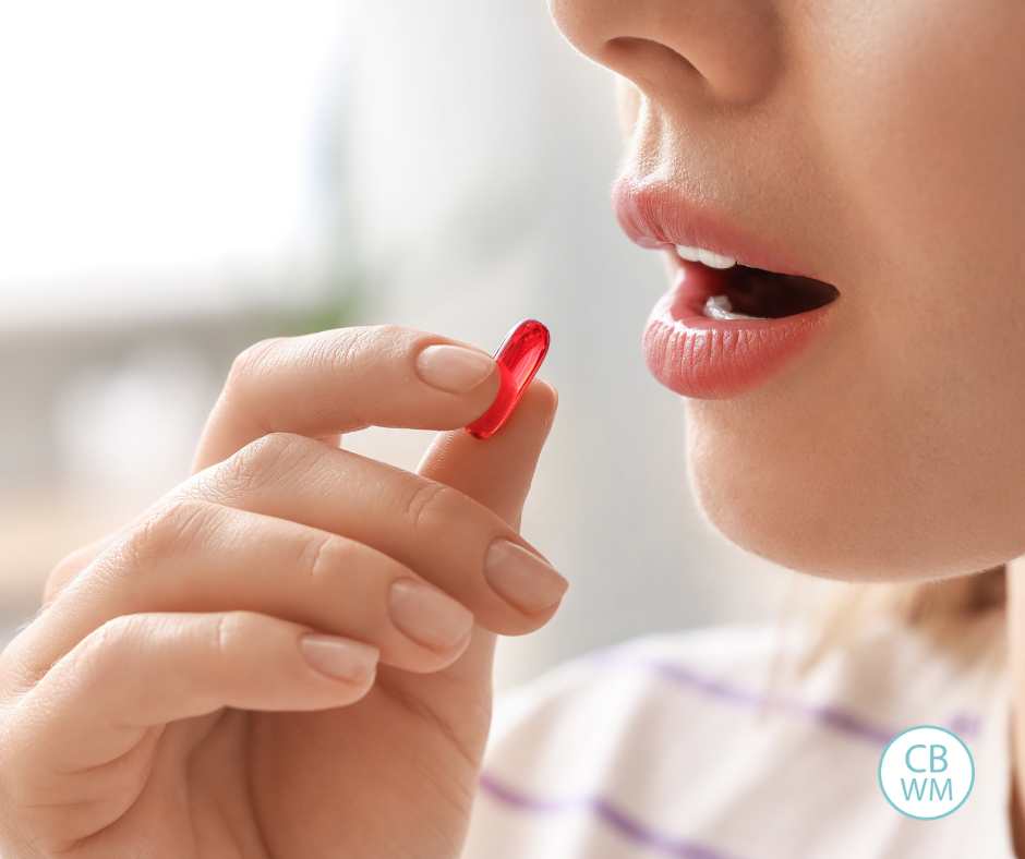 Woman taking a vitamin