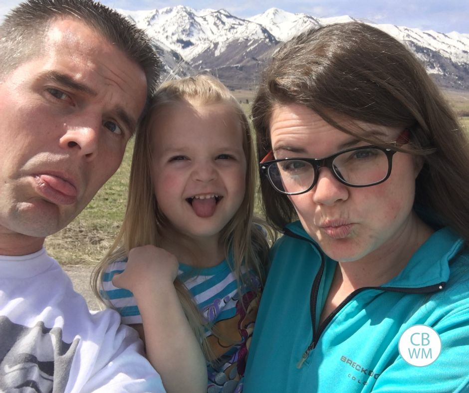 Nate, Brinley, and Valerie outside with mountains in the background