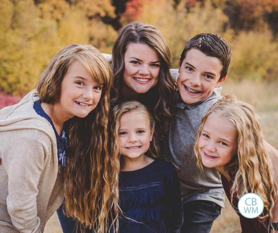 Valerie with her four kids surrounding her