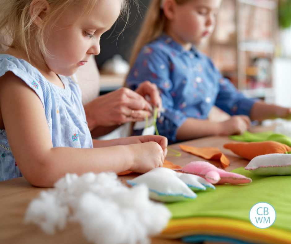 Children learning to sew little stuffed animals