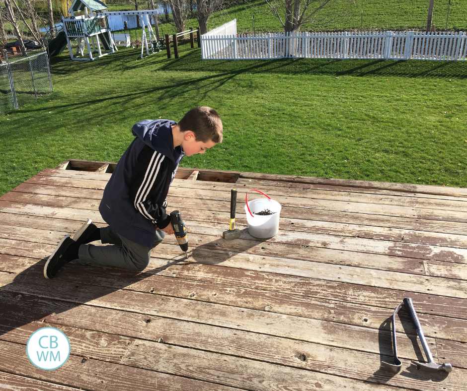 Brayden working on removing our deck